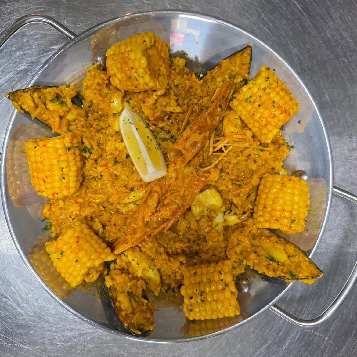 Ghost seafood platter with prawns, mussels, rice, corn and lemon